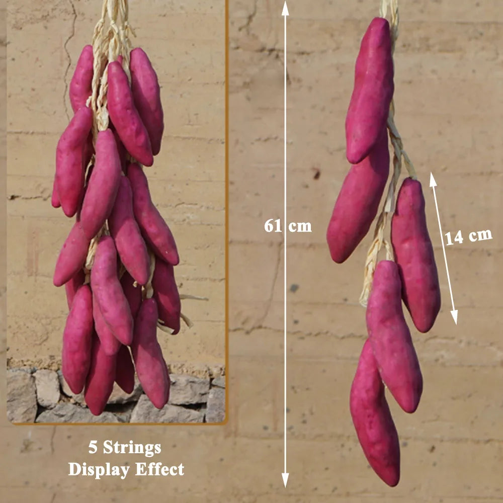 Artificial strings model assorted vegetables and fruits.