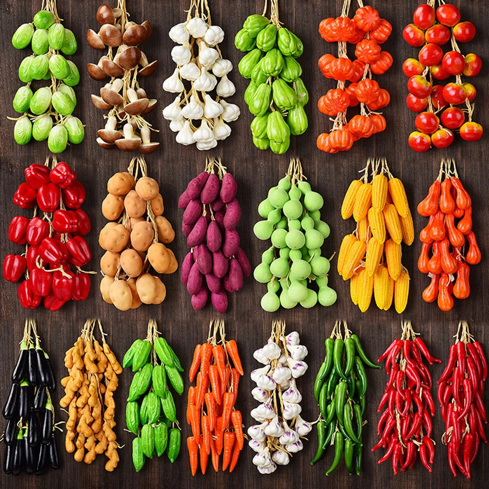 Artificial strings model assorted vegetables and fruits.