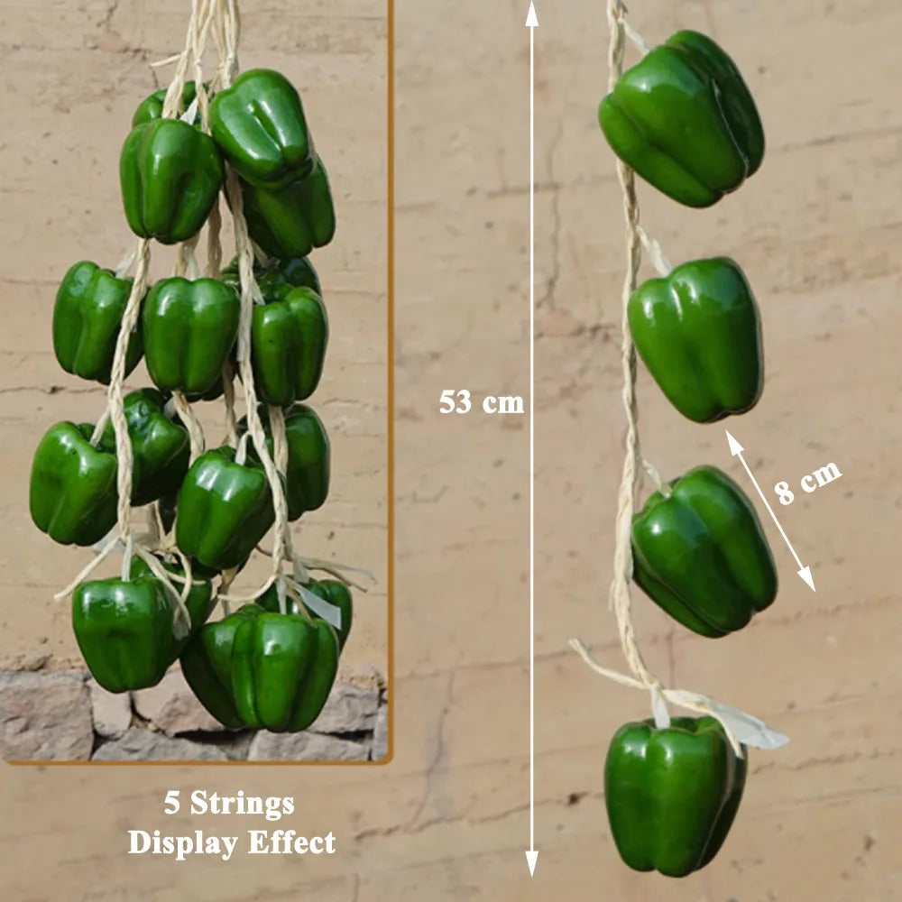 Artificial strings model assorted vegetables and fruits.
