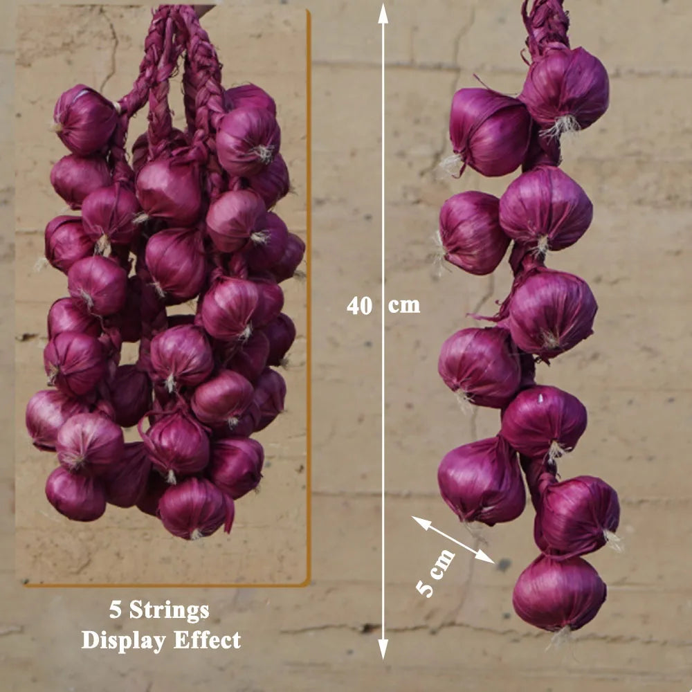 Artificial strings model assorted vegetables and fruits.