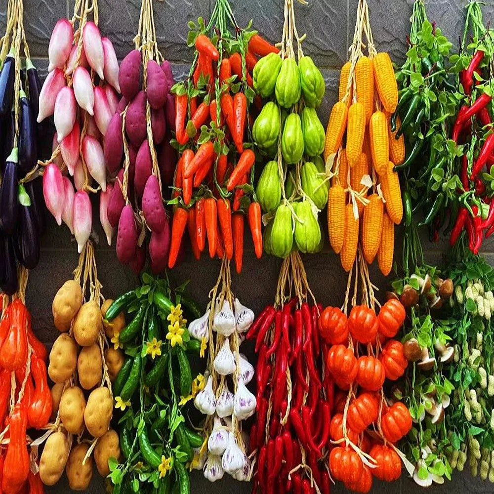 Artificial strings model assorted vegetables and fruits.