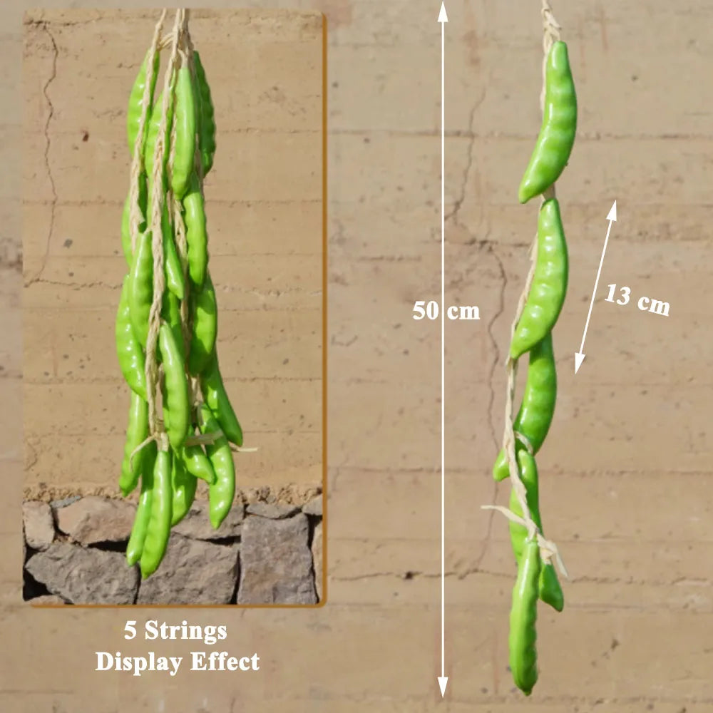 Artificial strings model assorted vegetables and fruits.