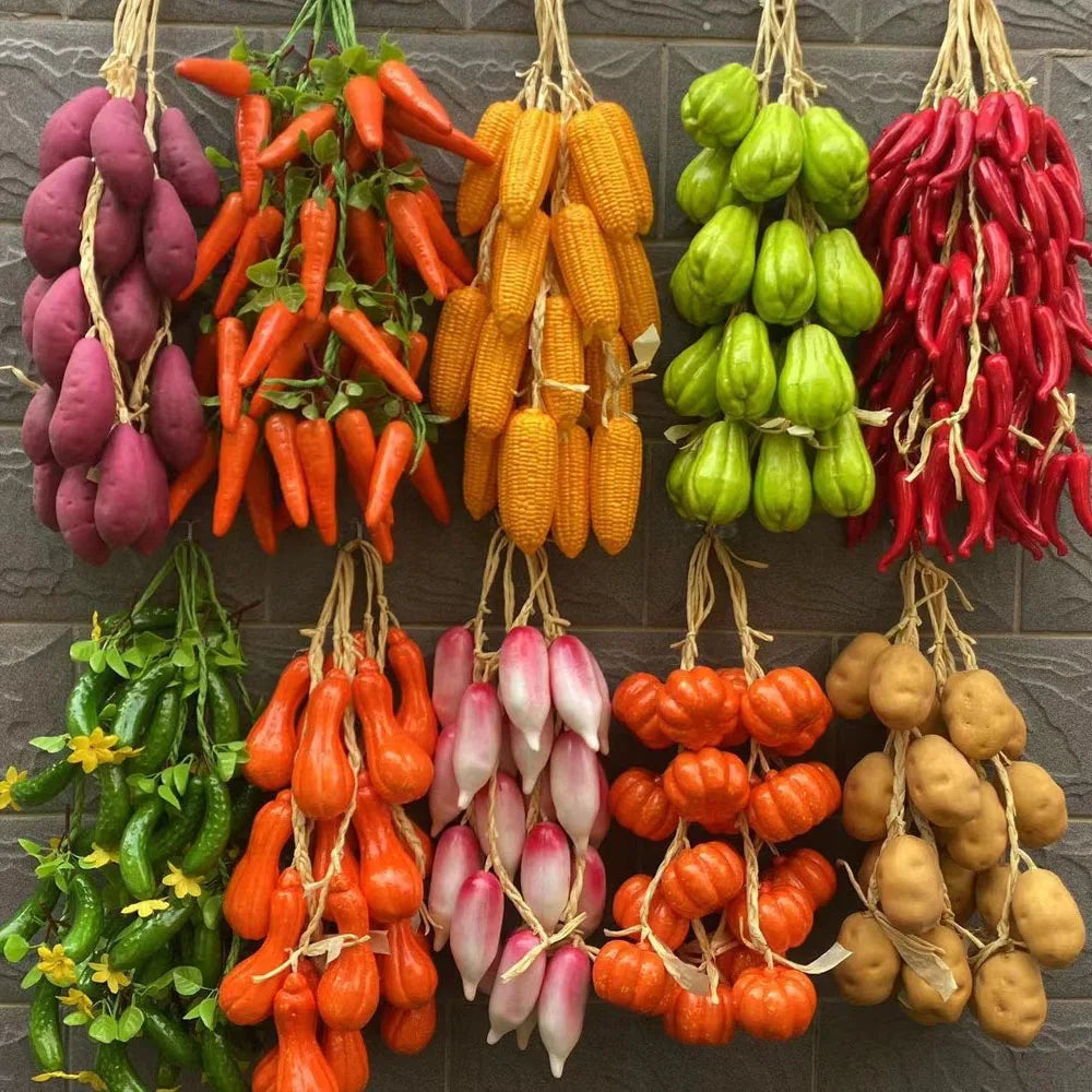 Artificial strings model assorted vegetables and fruits.