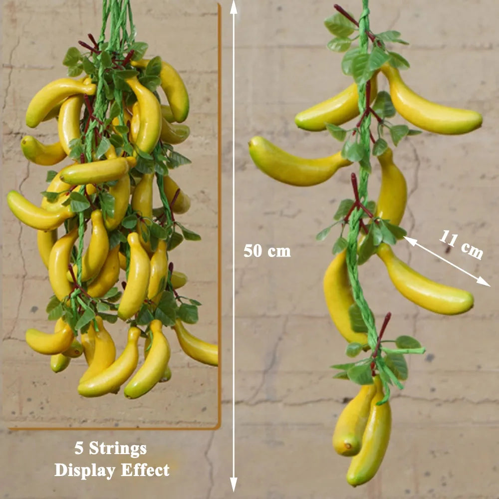 Artificial strings model assorted vegetables and fruits.