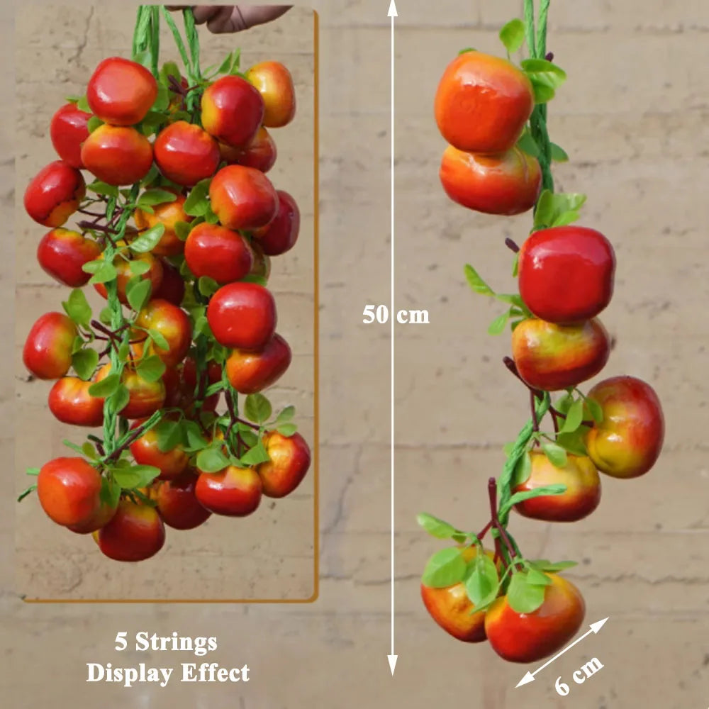 Artificial strings model assorted vegetables and fruits.
