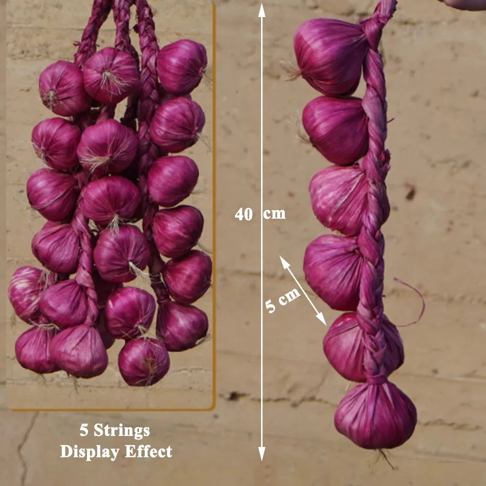 Artificial strings model assorted vegetables and fruits.