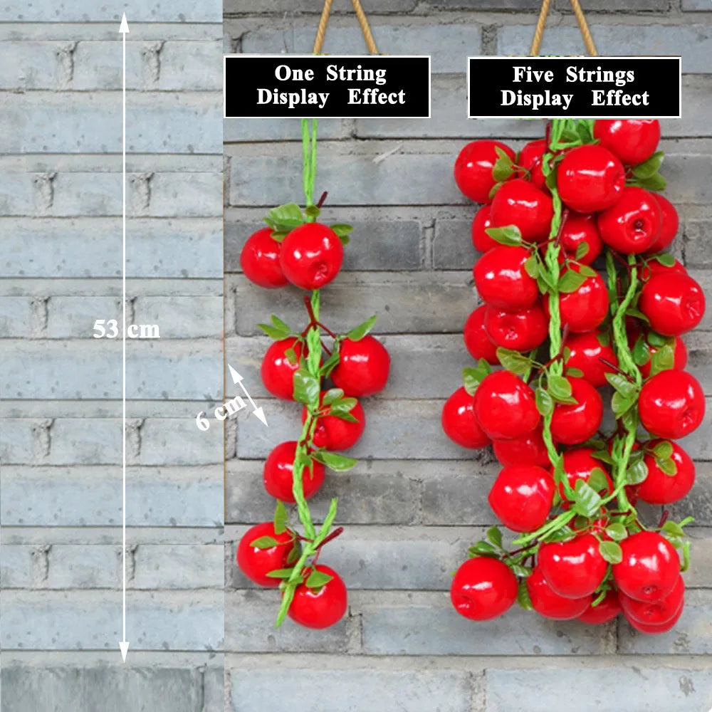 Artificial strings model assorted vegetables and fruits.