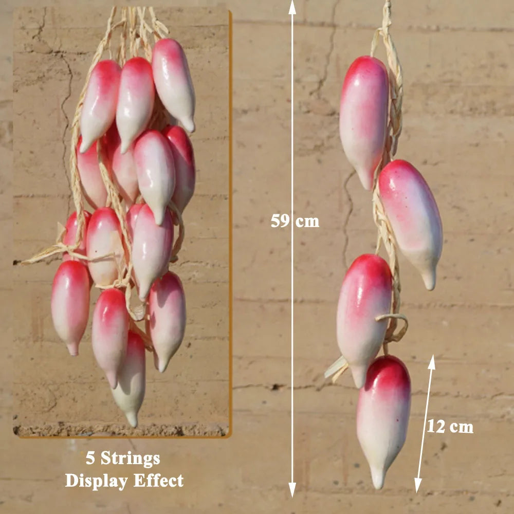 Artificial strings model assorted vegetables and fruits.