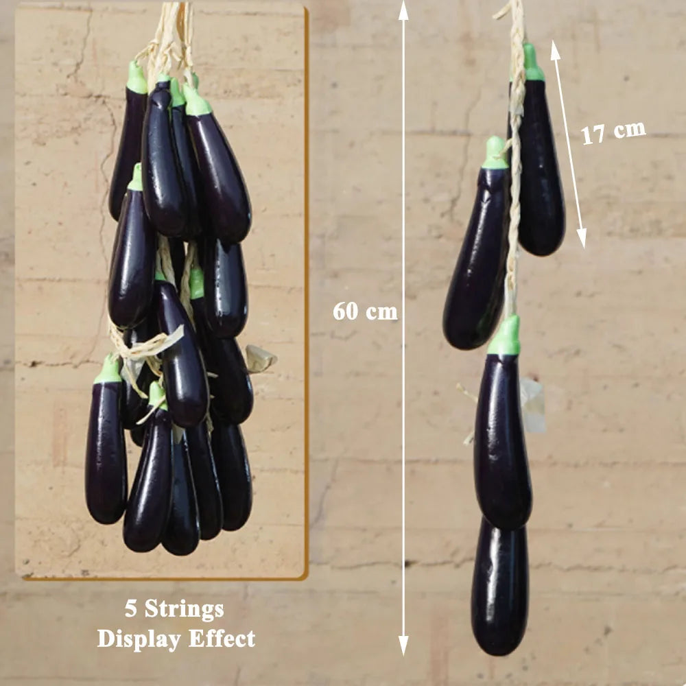 Artificial strings model assorted vegetables and fruits.