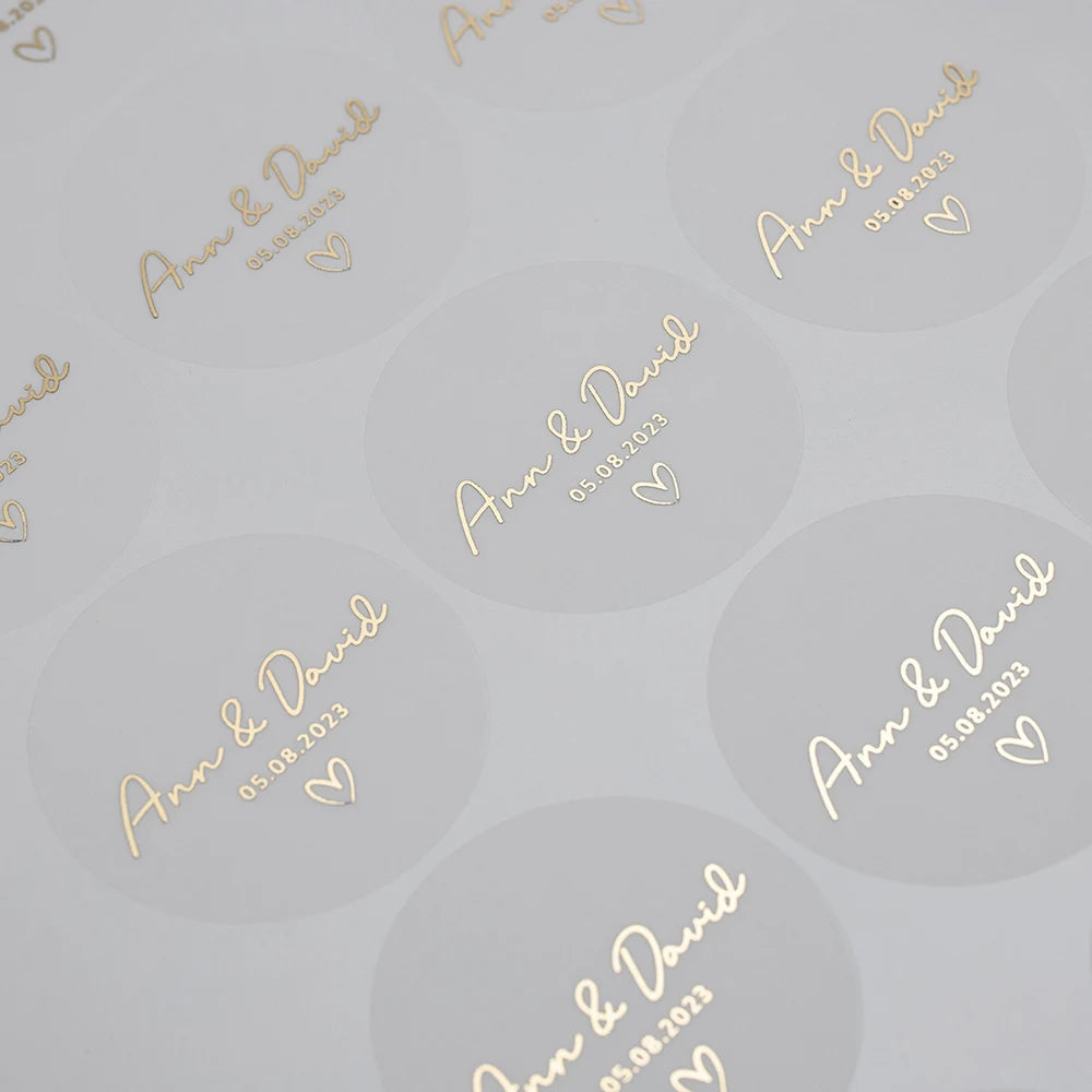 Transparente Etikettenaufkleber aus Goldfolie, ideal für alle Event-Briefpapiere.