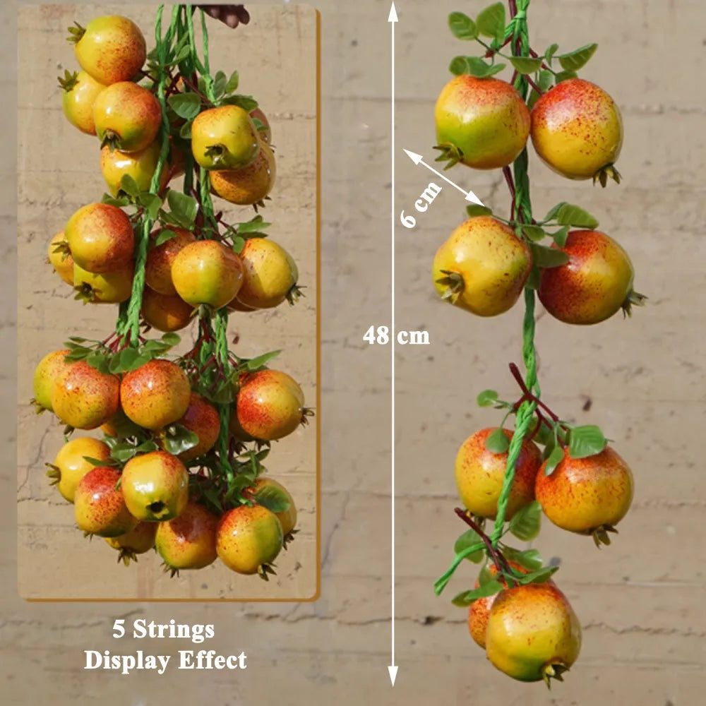 Artificial strings model assorted vegetables and fruits.