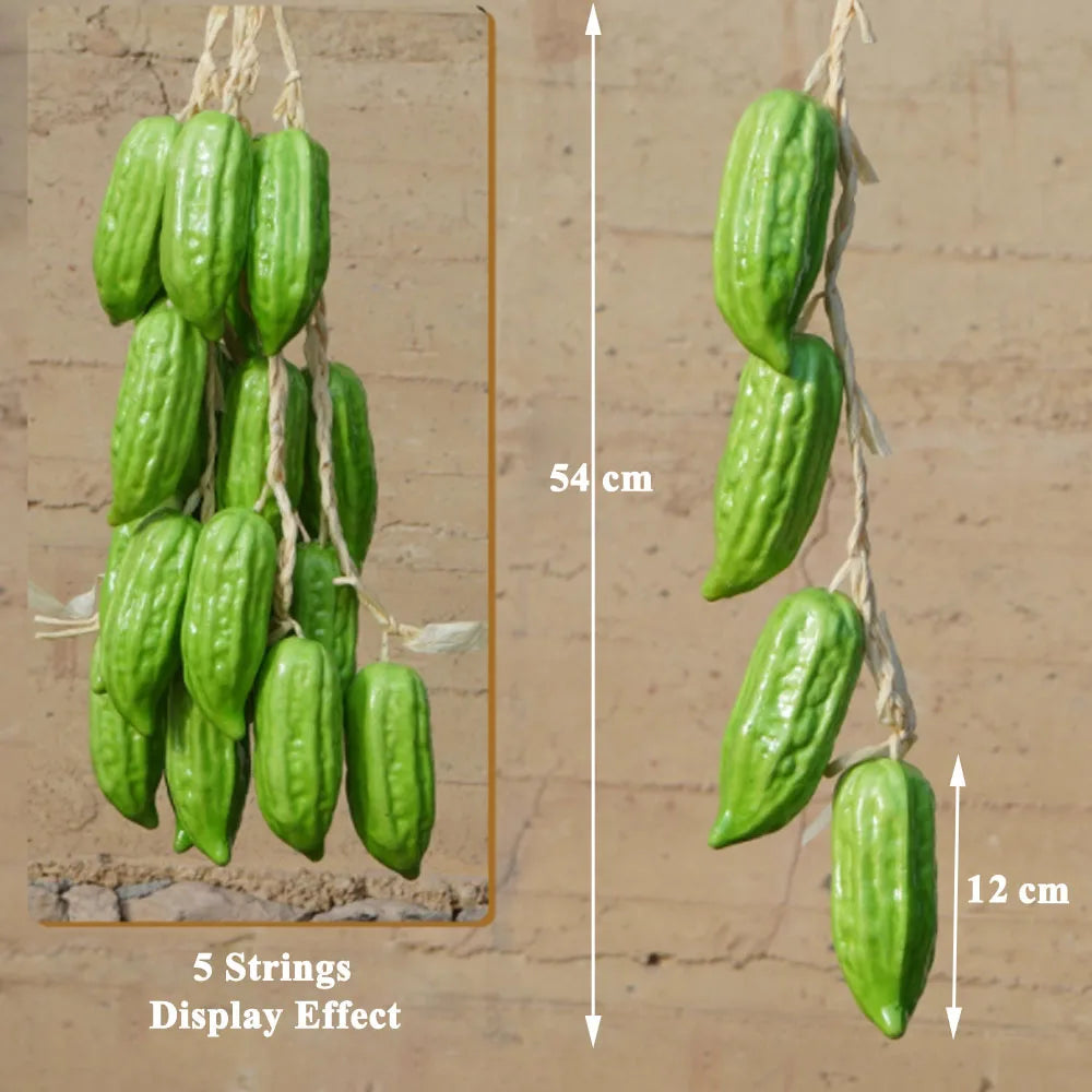 Artificial strings model assorted vegetables and fruits.