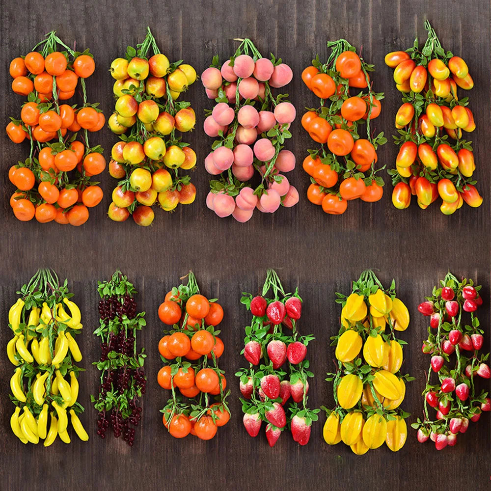 Artificial strings model assorted vegetables and fruits.